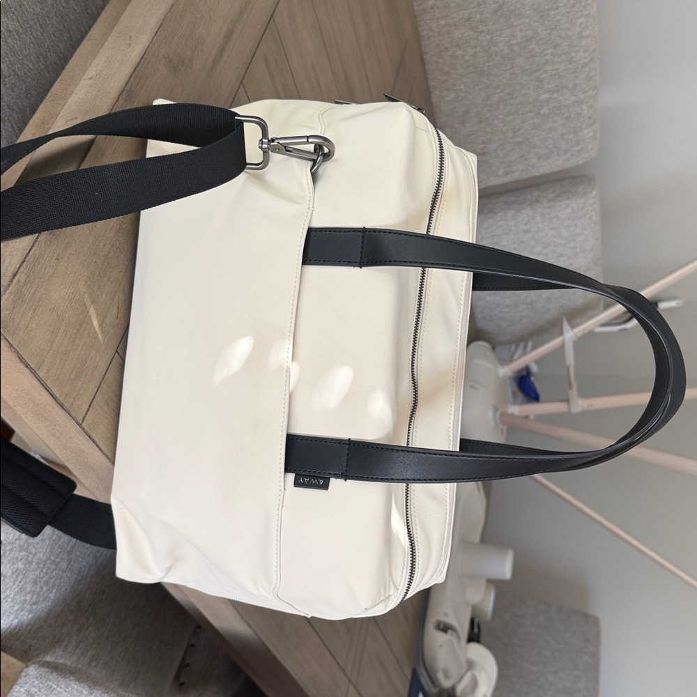 Away Cream and Black Travel Bag